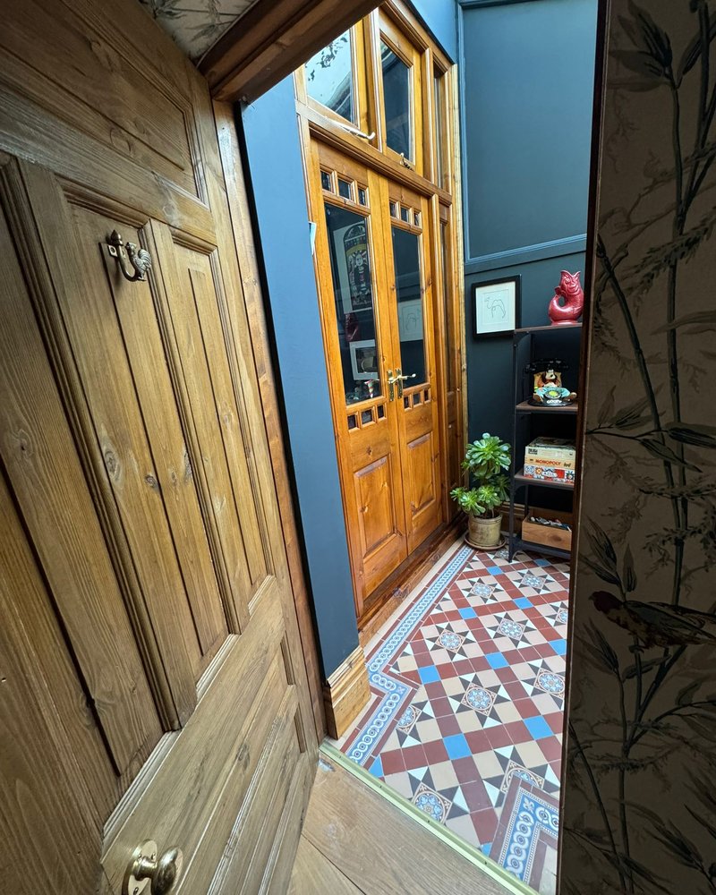 Restored period sun room with Victorian floor tiles