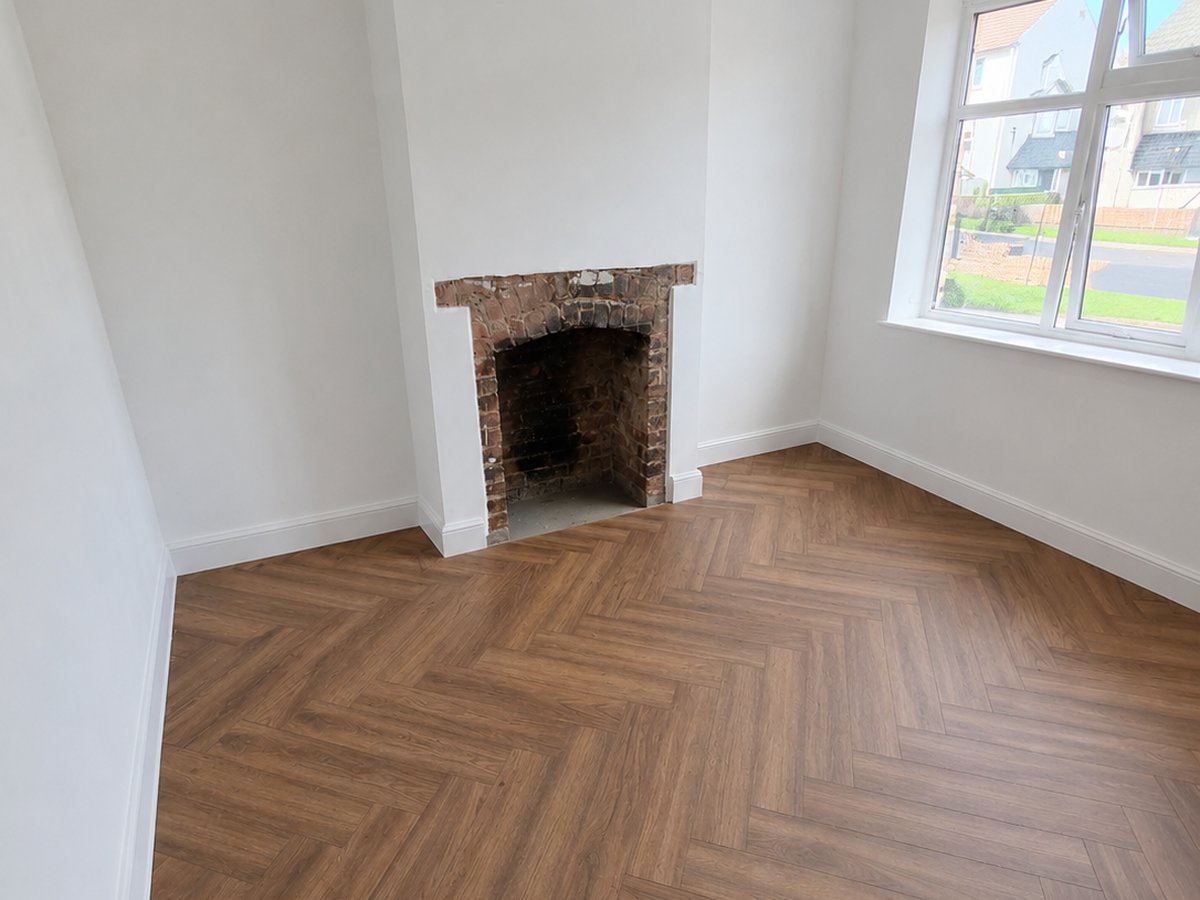 Herringbone flooring being installed